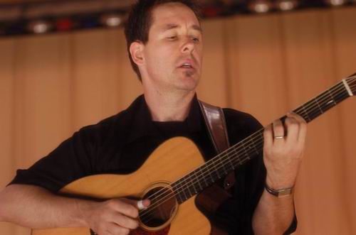 Pete Huttlinger at Unknown Venue Somewhere, US on June 24, 2003 &mdash; concert photo by Wayne Dennon