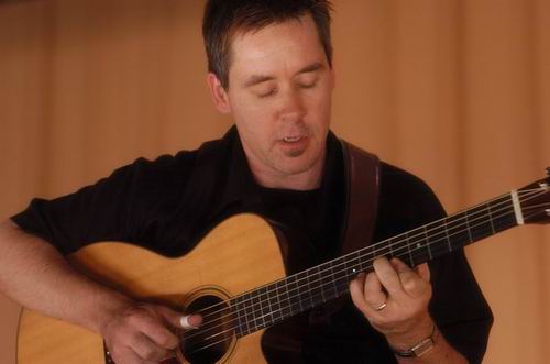 Pete Huttlinger at Unknown Venue Somewhere, US on June 24, 2003 &mdash; concert photo by Wayne Dennon